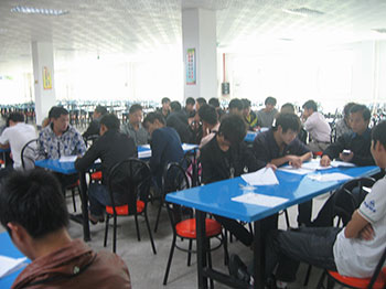 People filling out forms as part of recruitment